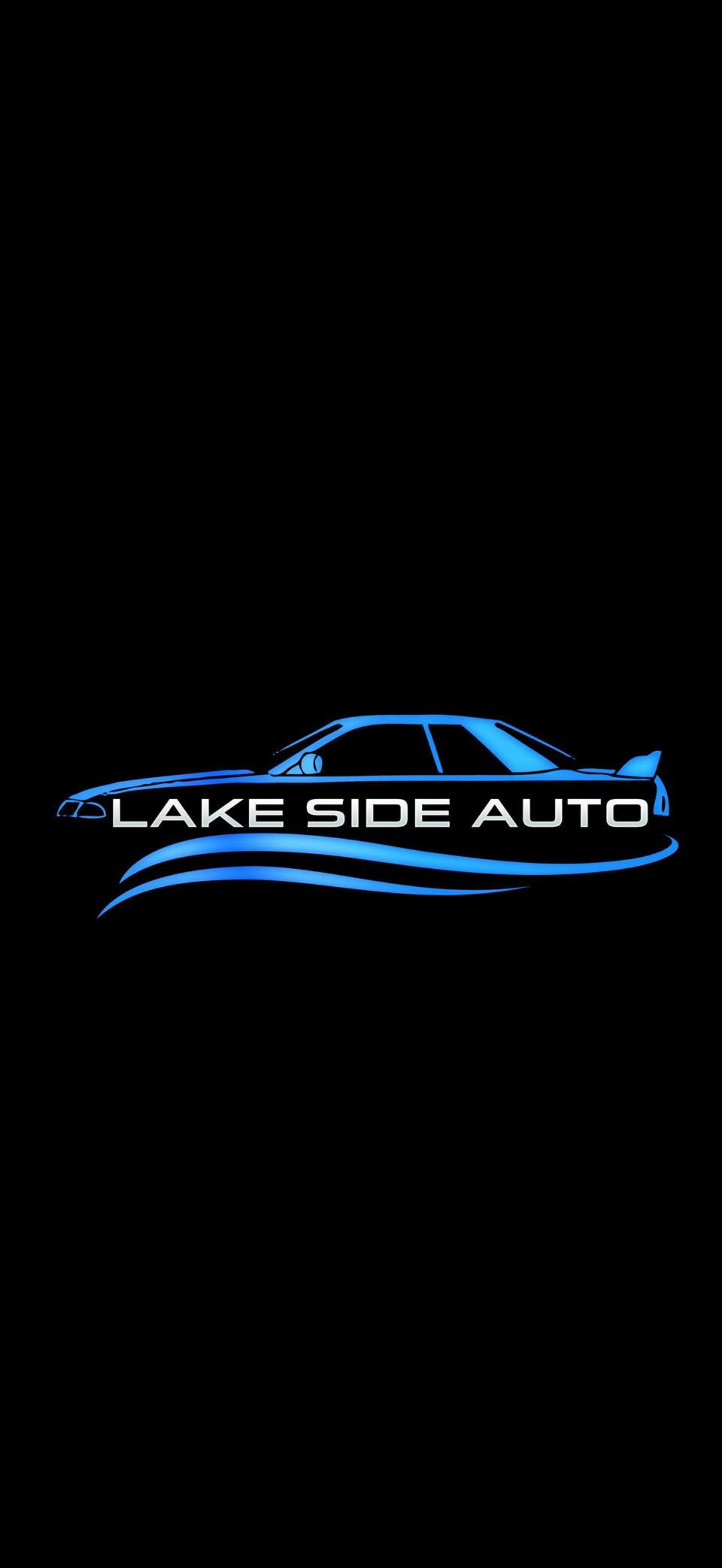 Logo for Lake Side Auto featuring a stylized blue outline of a car with blue waves beneath it and the business name in white