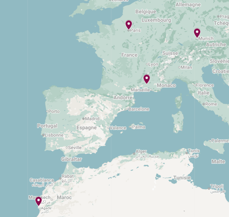 Map of Europe, North Africa, and parts of the Middle East with four pins marking locations in France, Germany, Italy, and Morocco.
