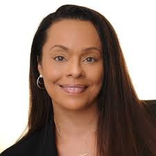 A professional headshot of Michele Stringer