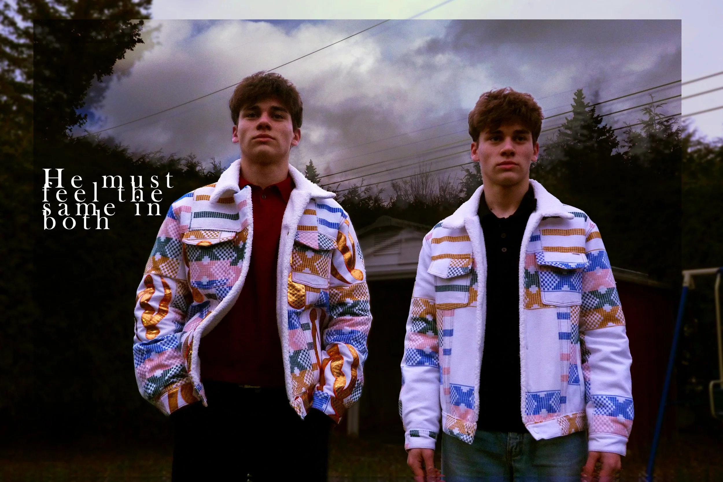 Two young men with similar facial features and hairstyles stand outdoors under a cloudy sky. They wear matching patterned jackets over black and red shirts. The background features trees, house rooftops, and power lines. Text on the image says, "He m