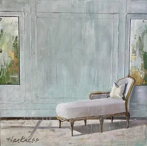 Empty vintage chaise lounge with pillow in a bright room with large windows and painted walls.