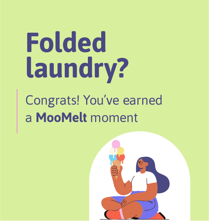 Celebratory message with a woman sitting cross-legged, holding a cone of ice cream with three scoops, on a light green background. Text reads 'Folded laundry? Congrats! You've earned a MooMelt moment'.