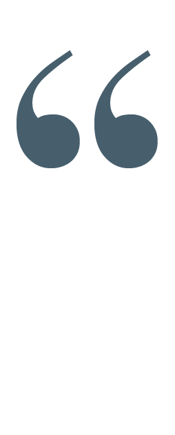 A large quotation mark icon in dark gray on a white background.