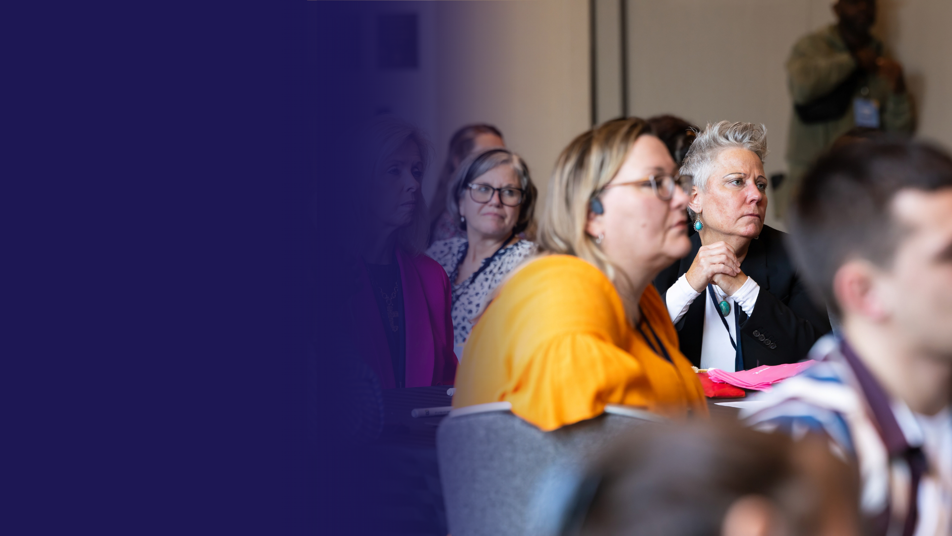 A group of people sitting at a session looking at the speaker