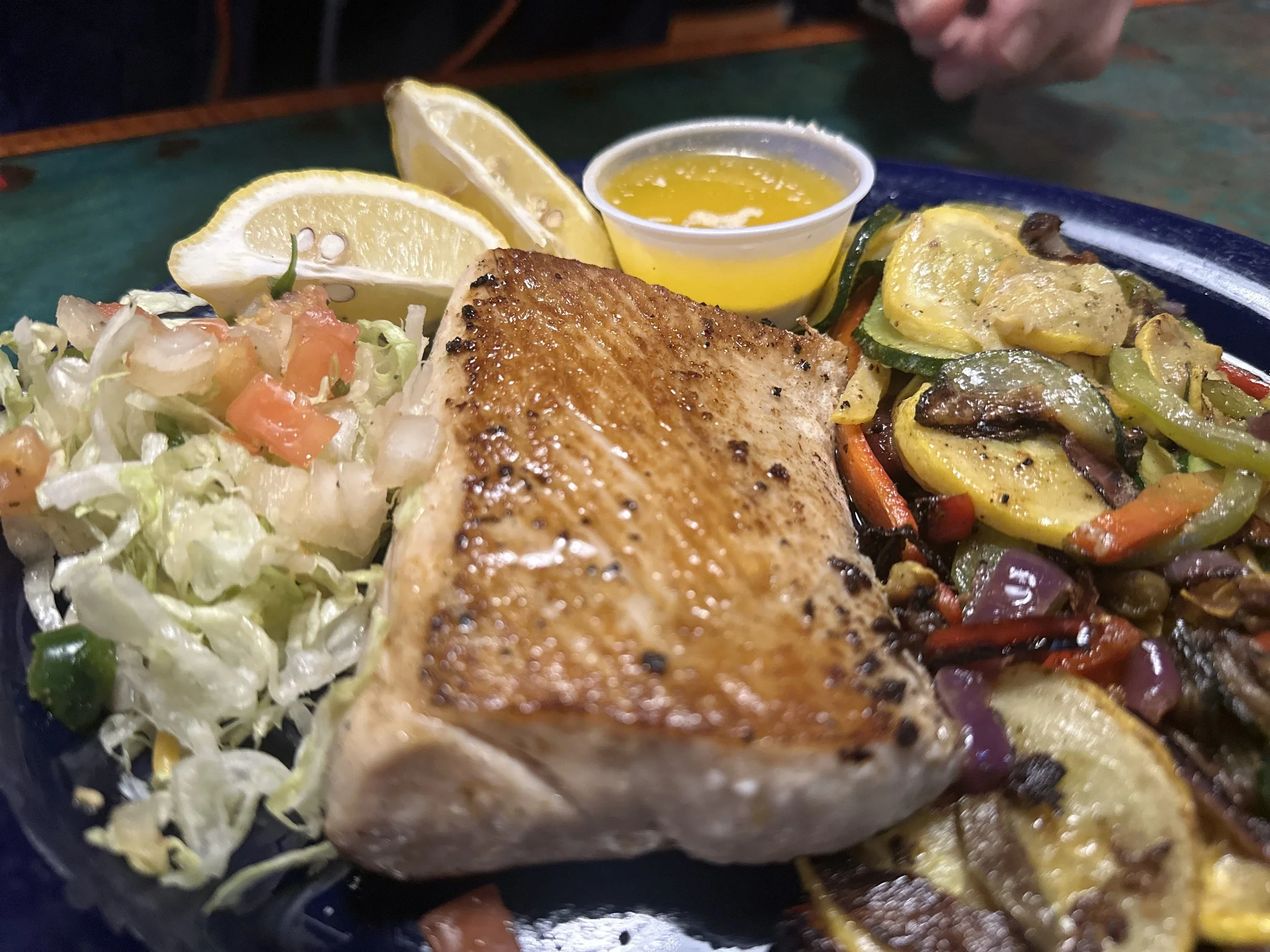 mahi mahi mesquite grilled at medium rare temperature served with vegtable medley and pico de gallo with chardonnay butter for dipping