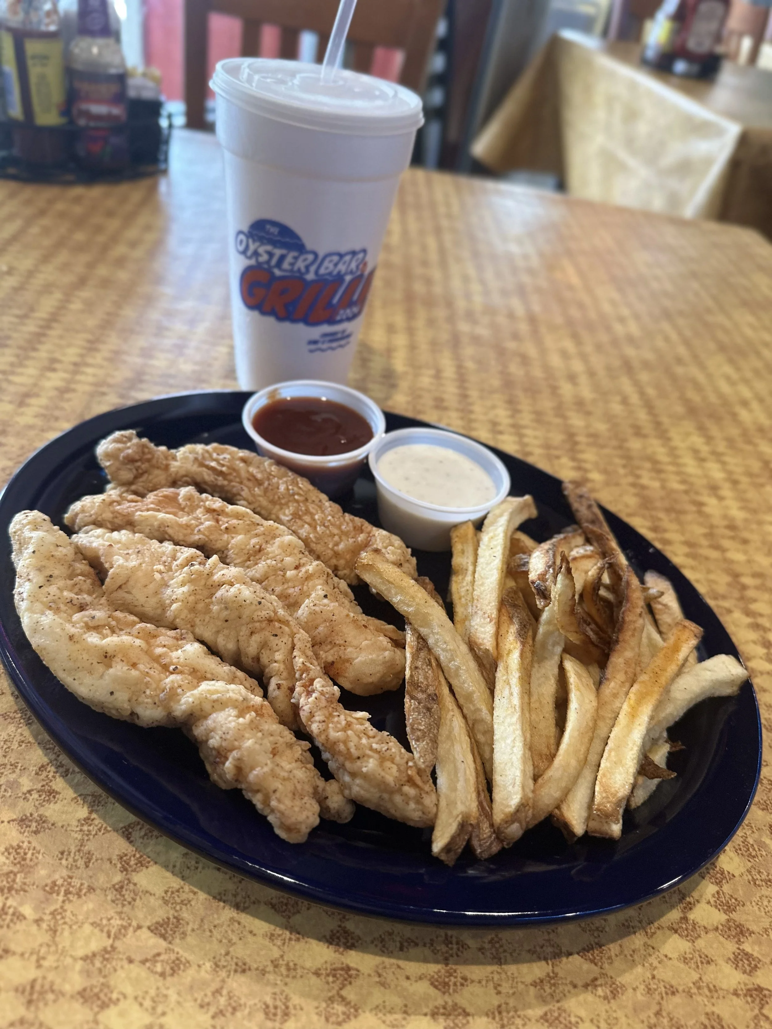 $10.99 menu chicken strips marinated, hand breaded and fried golden. hand cut fries on the side. barbque sauce and butter for dipping with frozen margarita