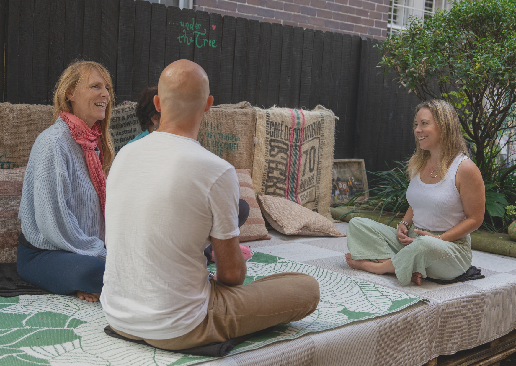 Four people talking outside