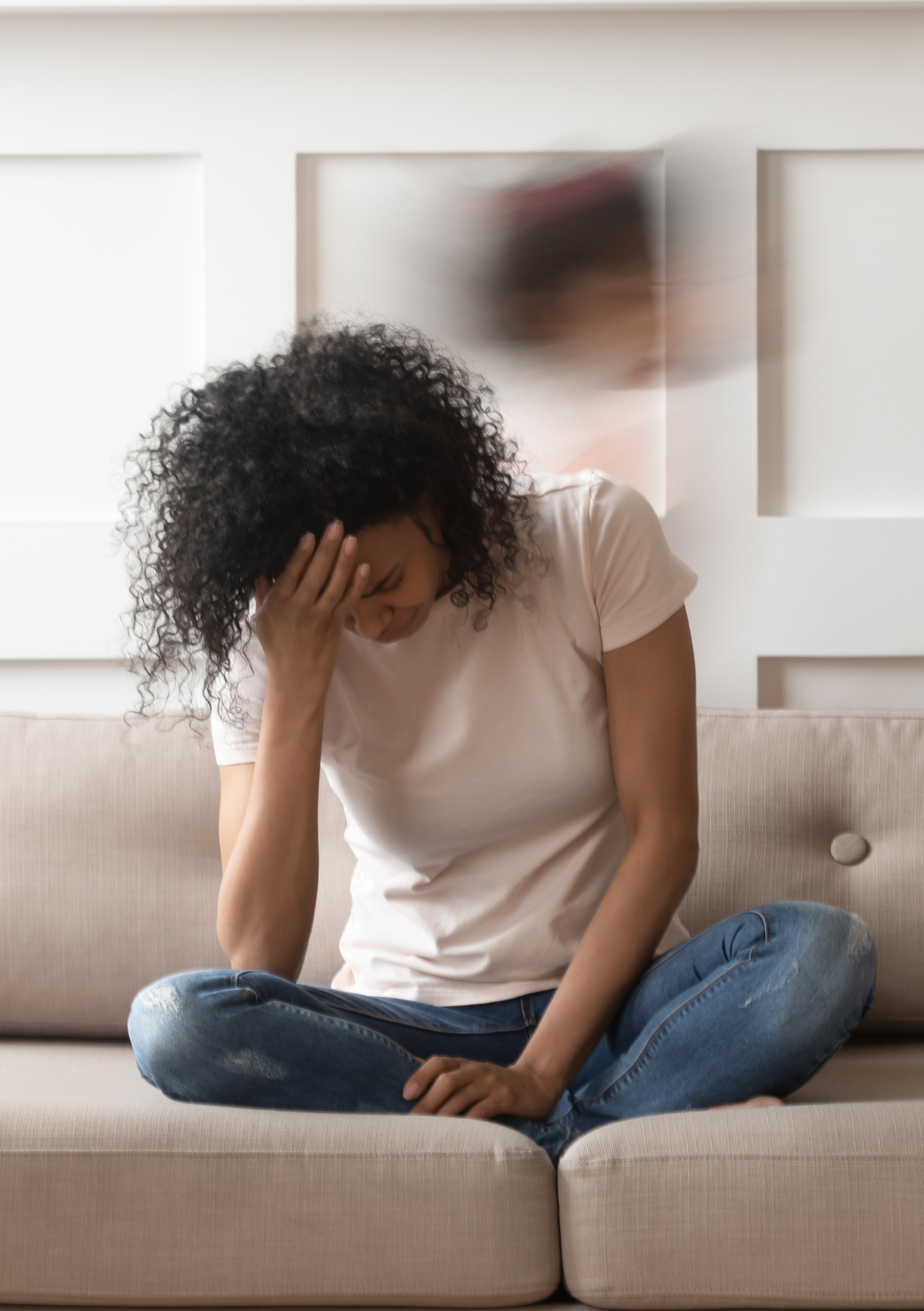 Woman sitting down with world rushing by