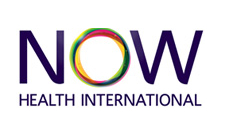 Logo for NOW Health International with the word 'NOW' in purple, the 'O' in rainbow colors, and 'HEALTH INTERNATIONAL' written below.