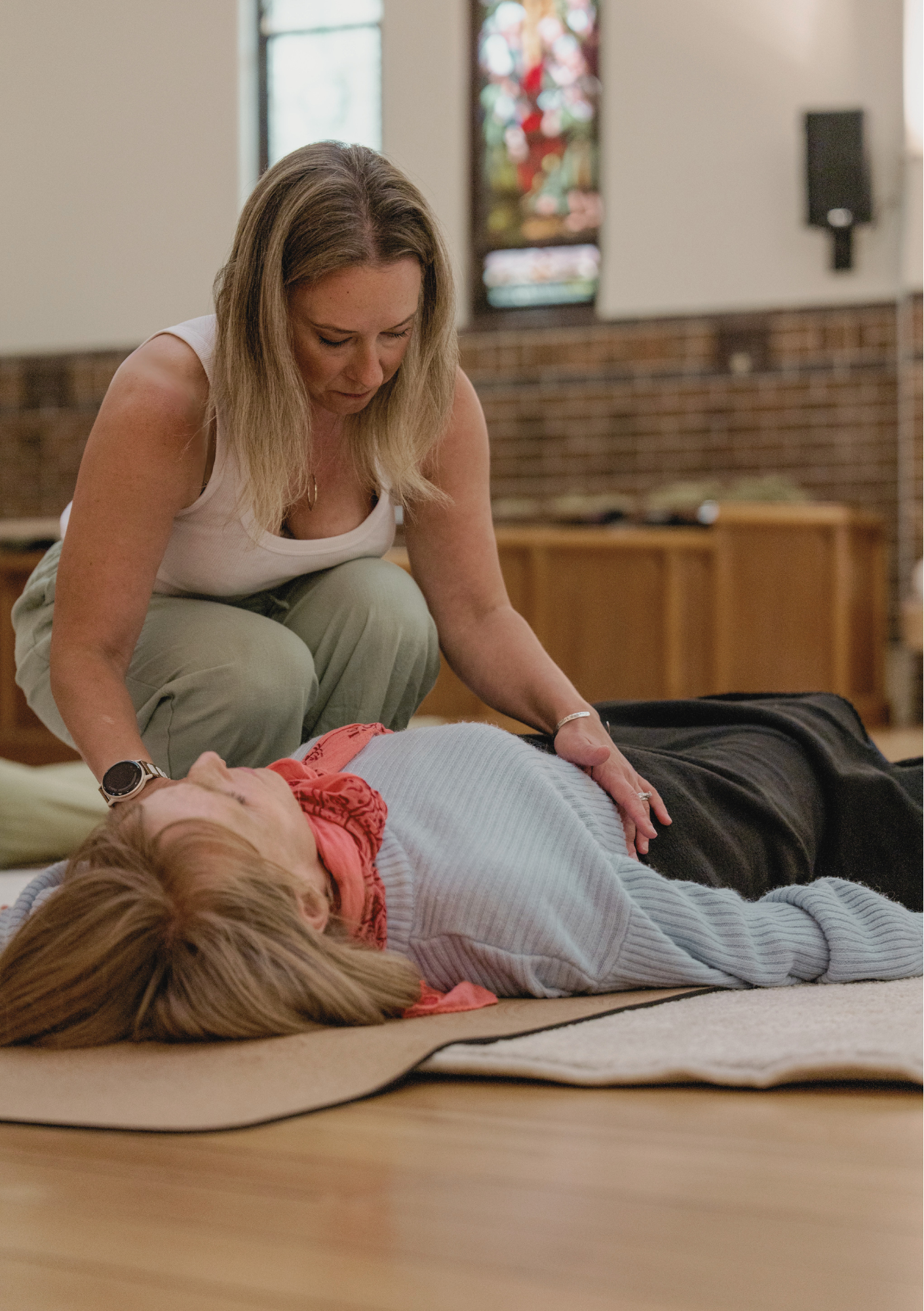 Facilitated breathwork with woman in a church