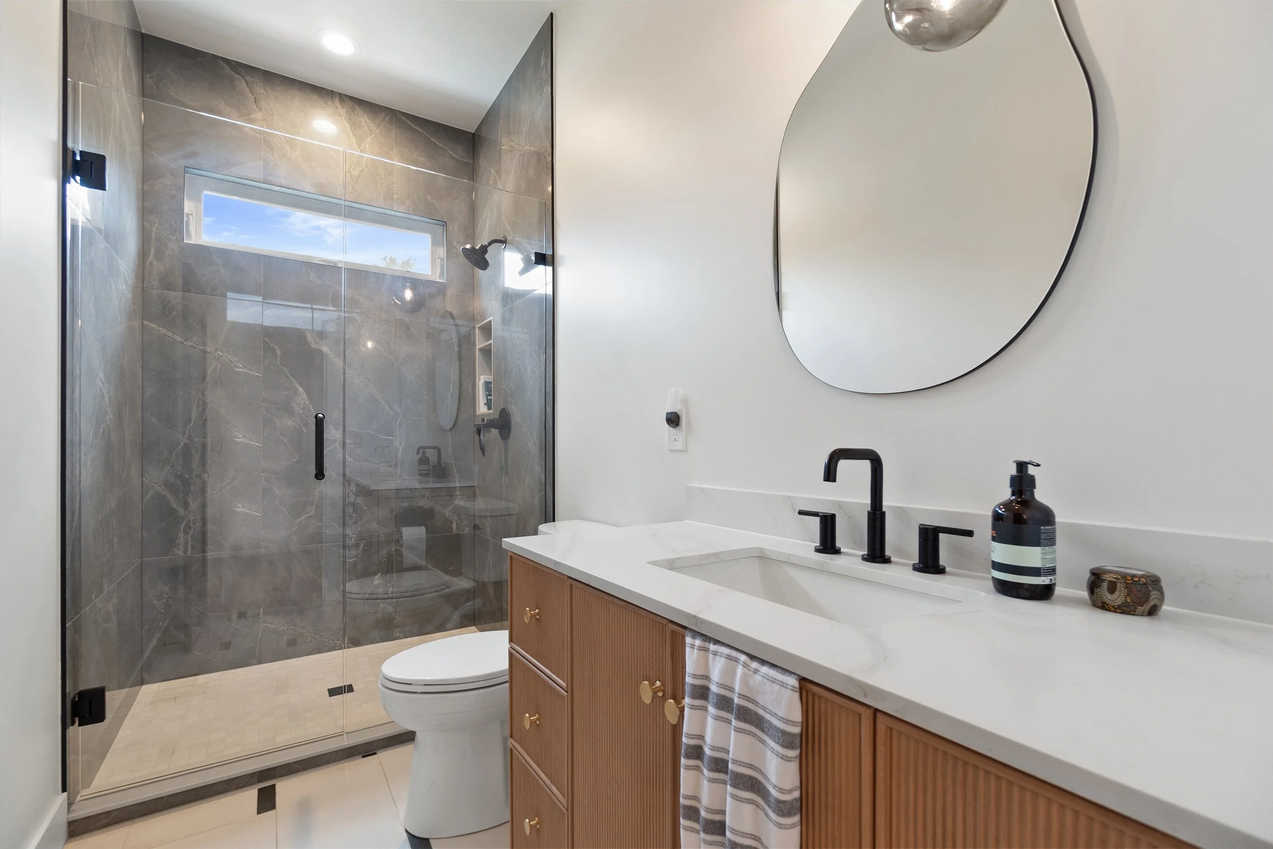Custom bathroom remodel with walk-in shower and designer fixtures in Greater Cincinnati by Shade Tree Homes