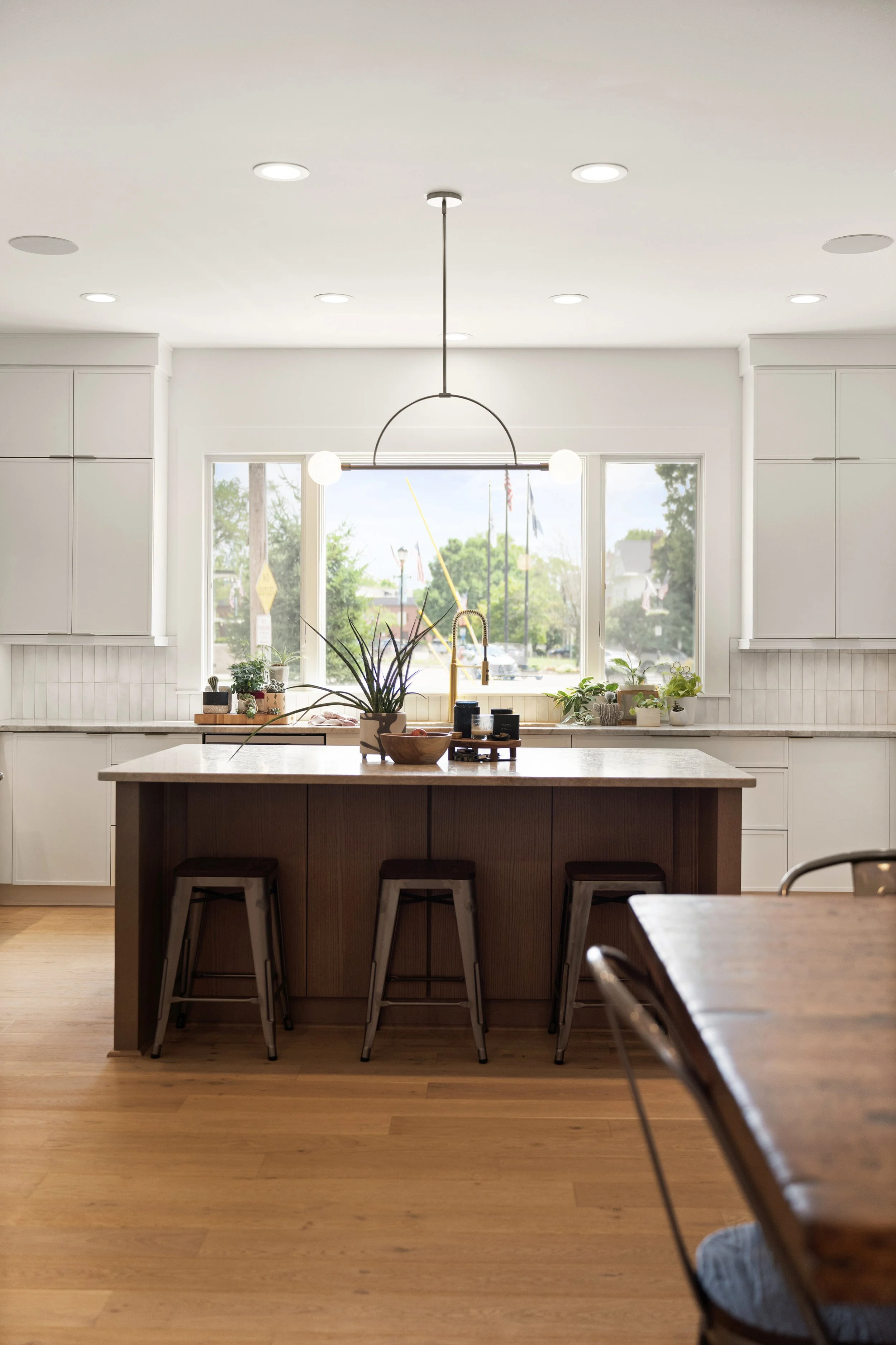 Large kitchen island with custom features in Fort Thomas Kentucky whole home remodel by Shade Tree Homes