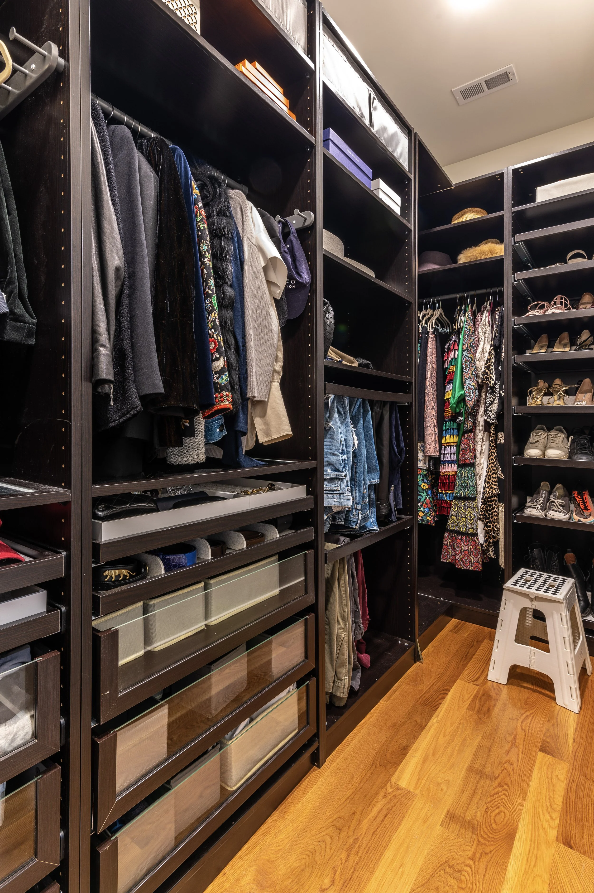 Custom walk-in closet with built-in storage in historic Covington Kentucky home by Shade Tree Homes