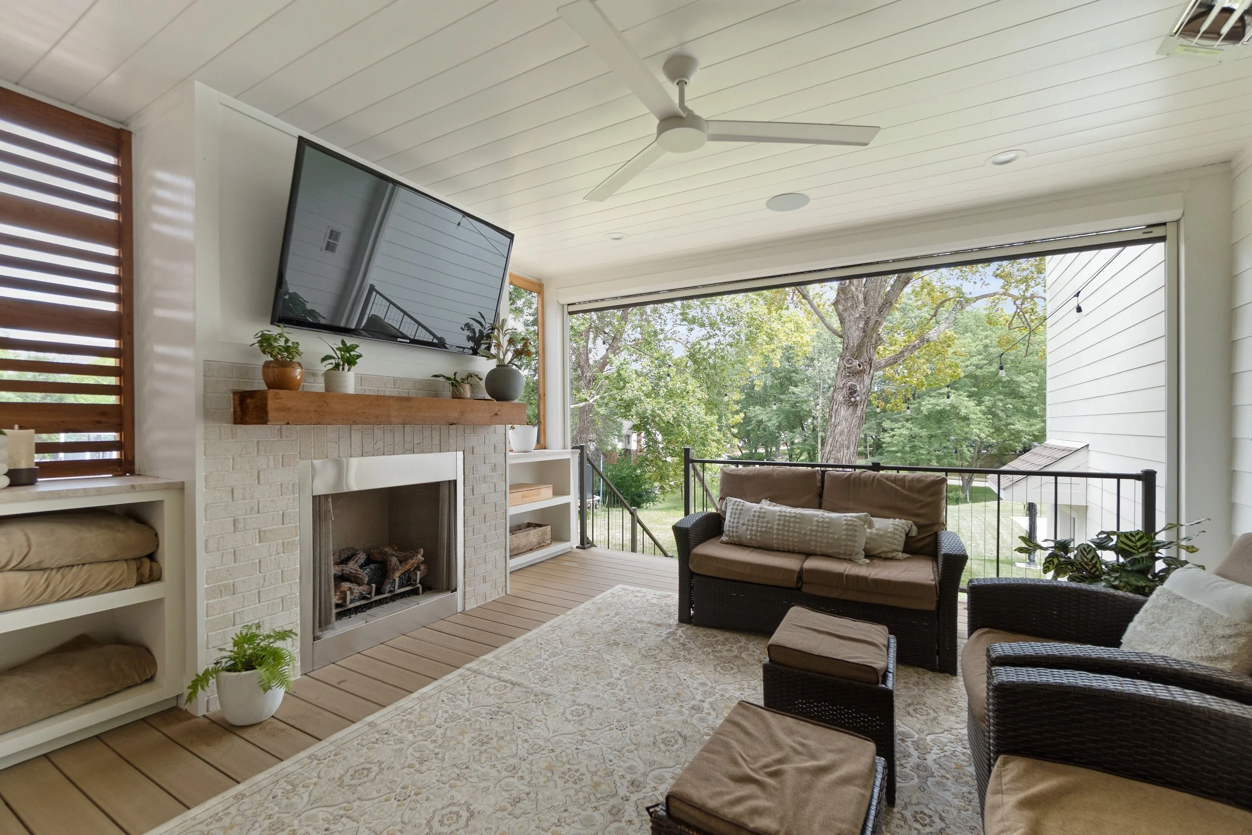 Custom outdoor living space with fireplace and covered ceiling in Northern Kentucky by Shade Tree Homes