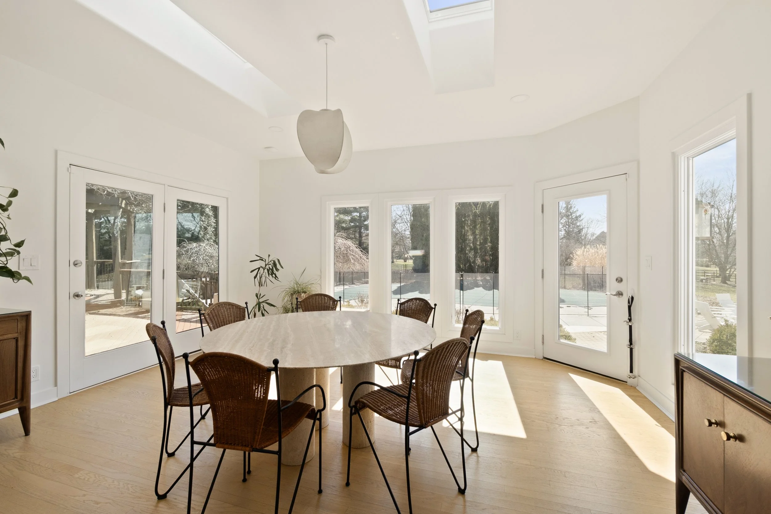 Bright breakfast area off custom kitchen in Amberley Village home by Shade Tree Homes