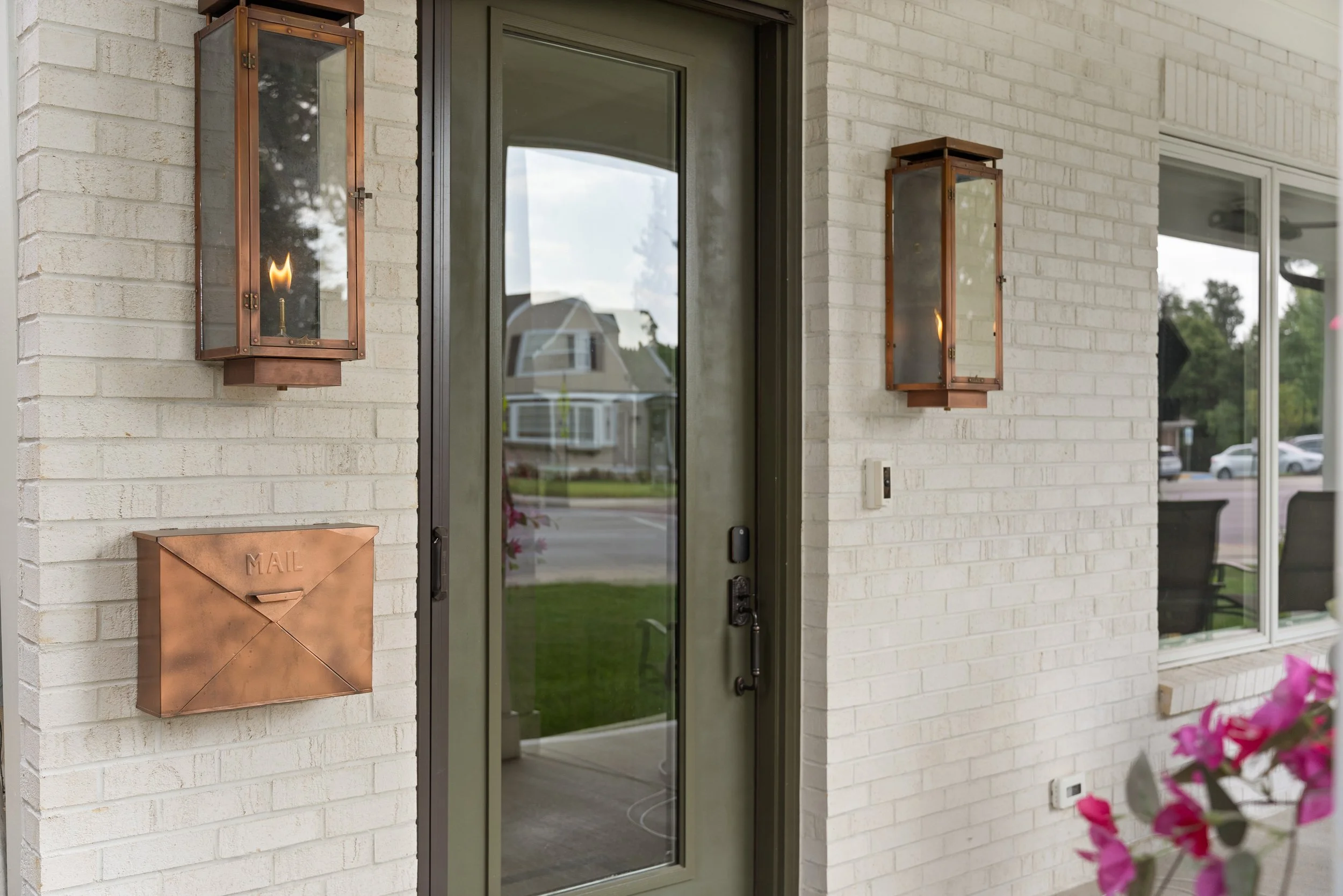 Restored front entrance with gas lanterns on 1890s landmark home in Fort Thomas Kentucky by Shade Tree Homes