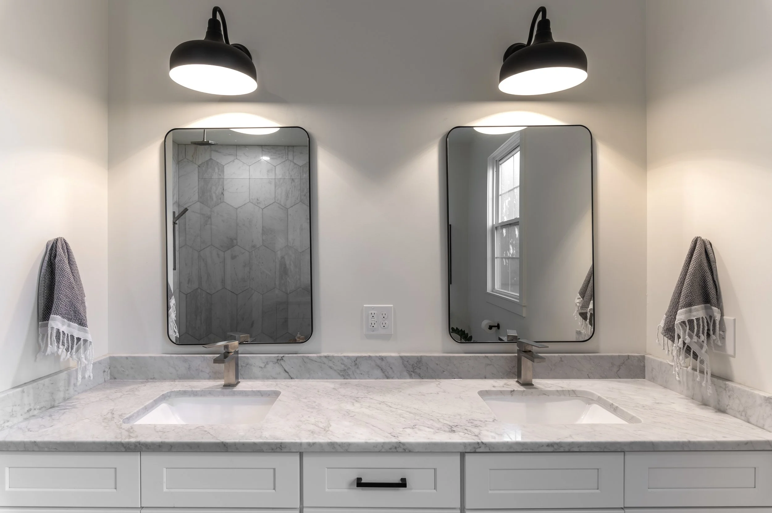 Primary bathroom vanity detail with designer fixtures in historic Covington Kentucky home by Shade Tree Homes