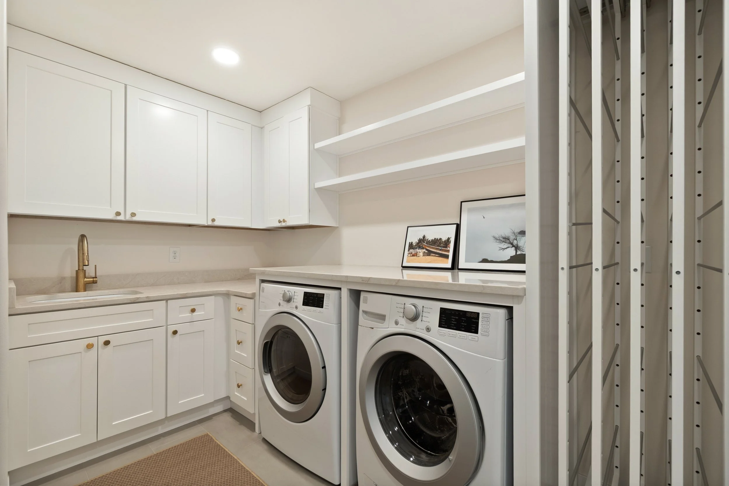 Custom laundry room with built-in storage in Amberley Village Ohio by Shade Tree Homes