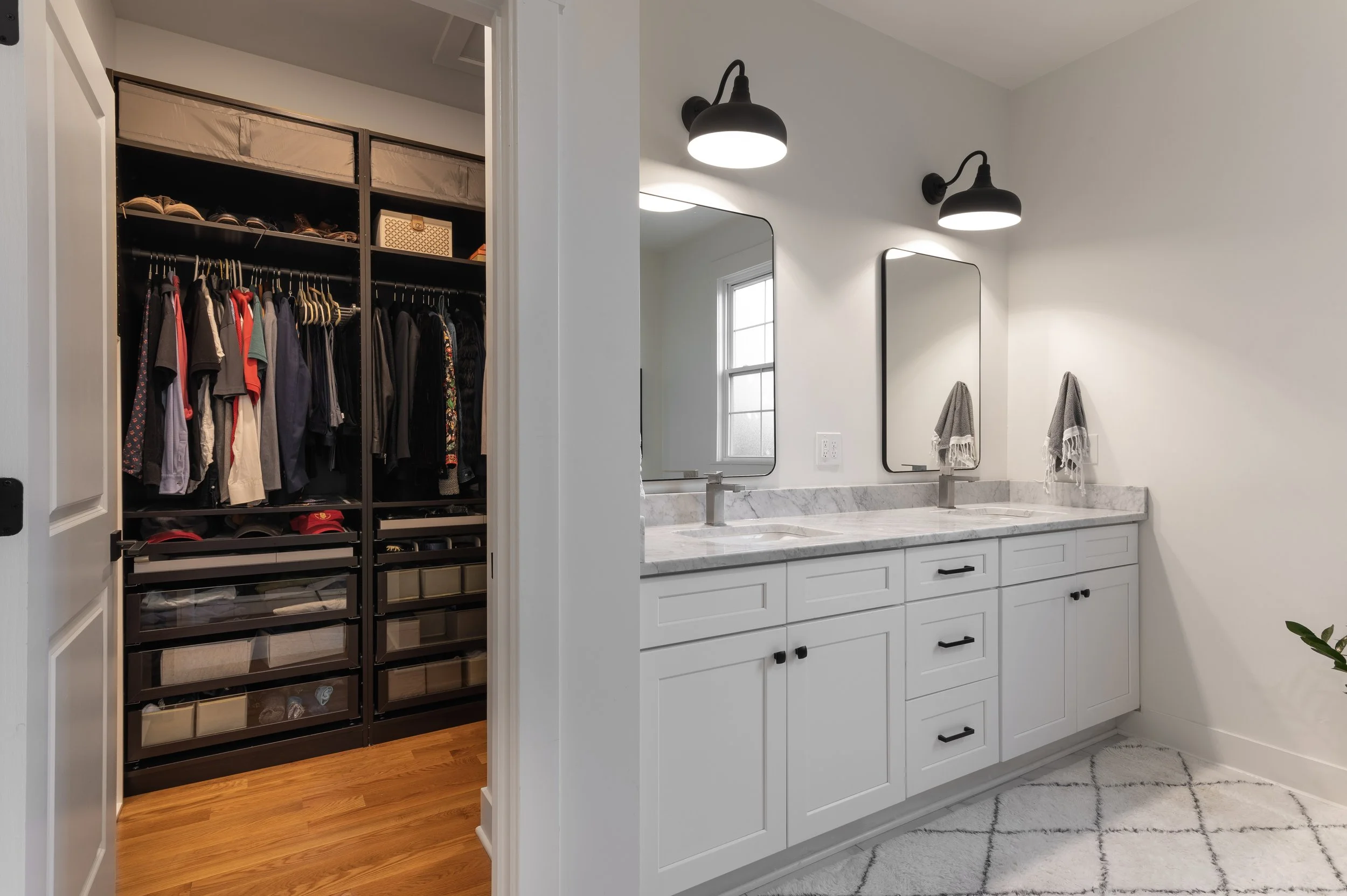 Primary bathroom vanity with walk-in closet access in Covington Kentucky remodel by Shade Tree Homes