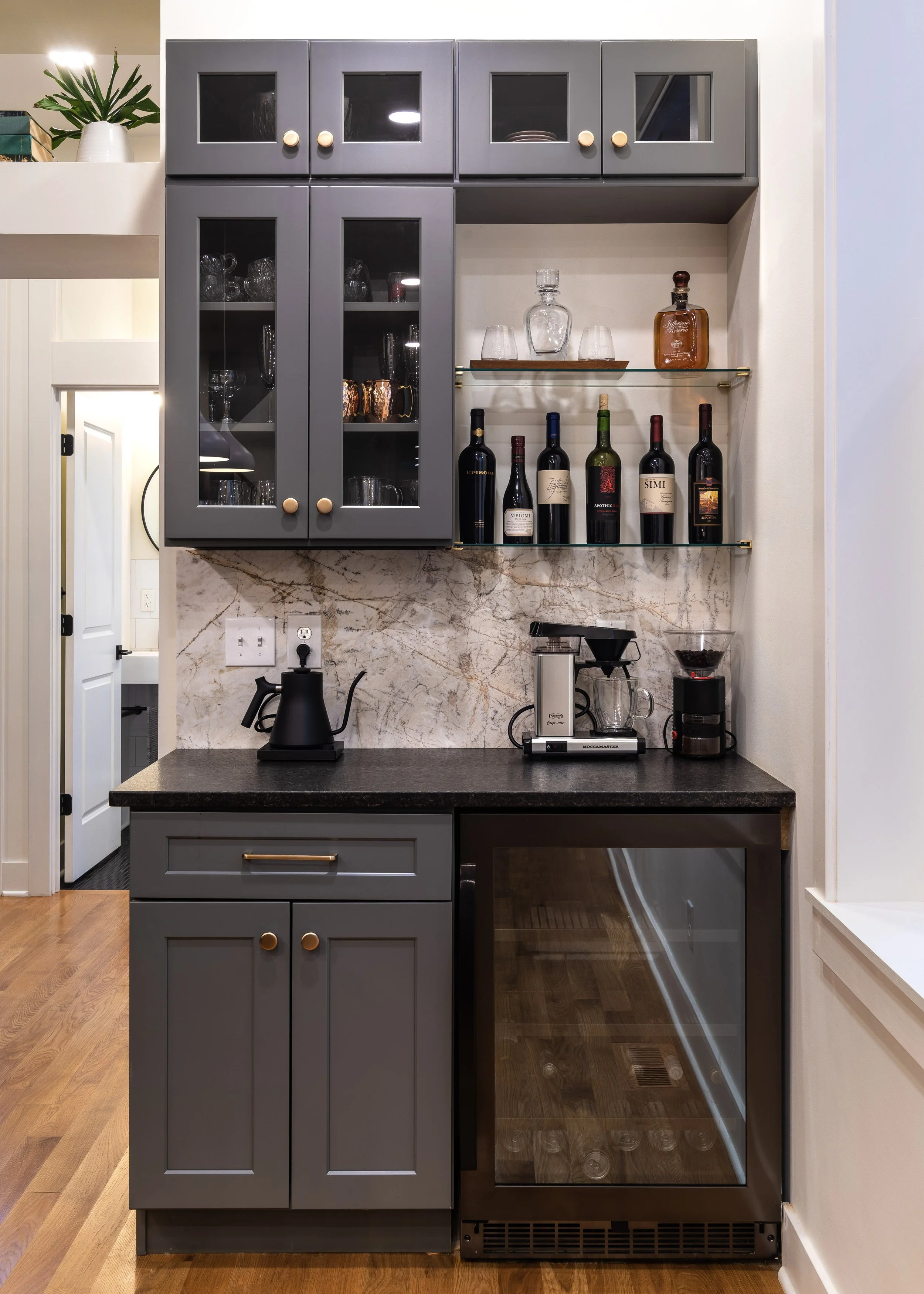 Custom wet bar with wine storage and granite countertop in Covington Kentucky remodel by Shade Tree Homes