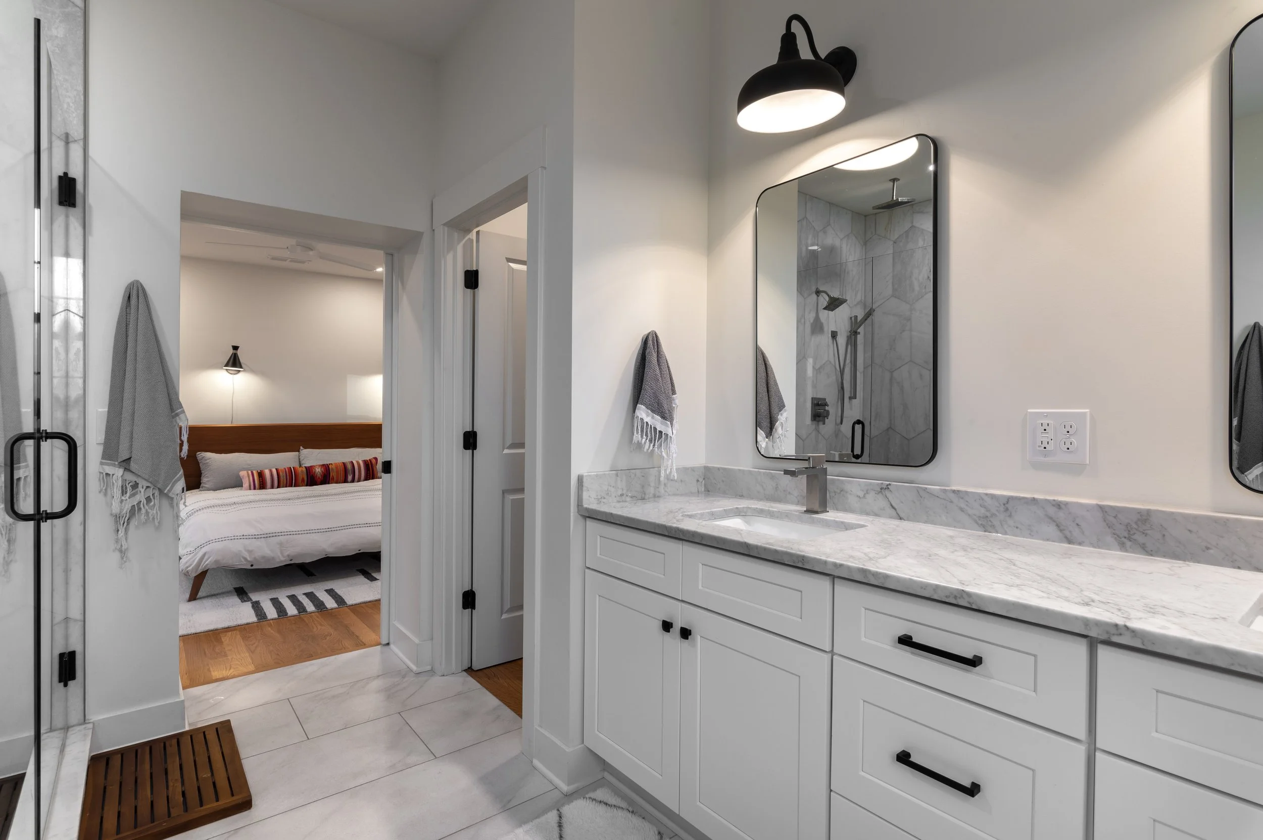 Primary bathroom vanity with walk-in closet access in Covington Kentucky remodel by Shade Tree Homes