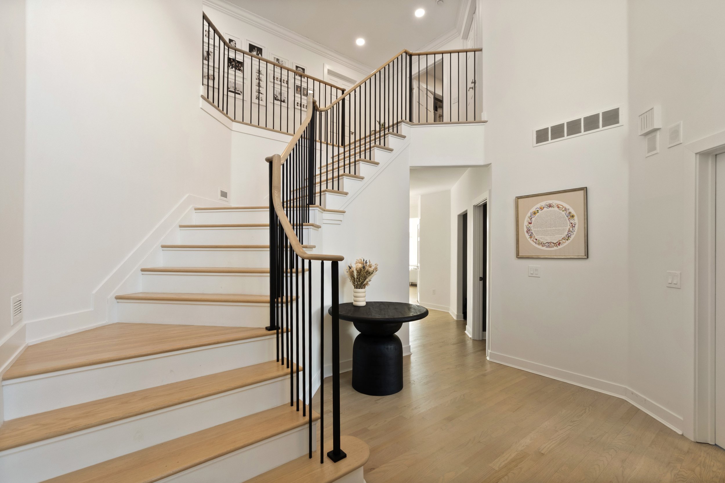 Grand foyer entry in custom Amberley Village Ohio home by Shade Tree Homes