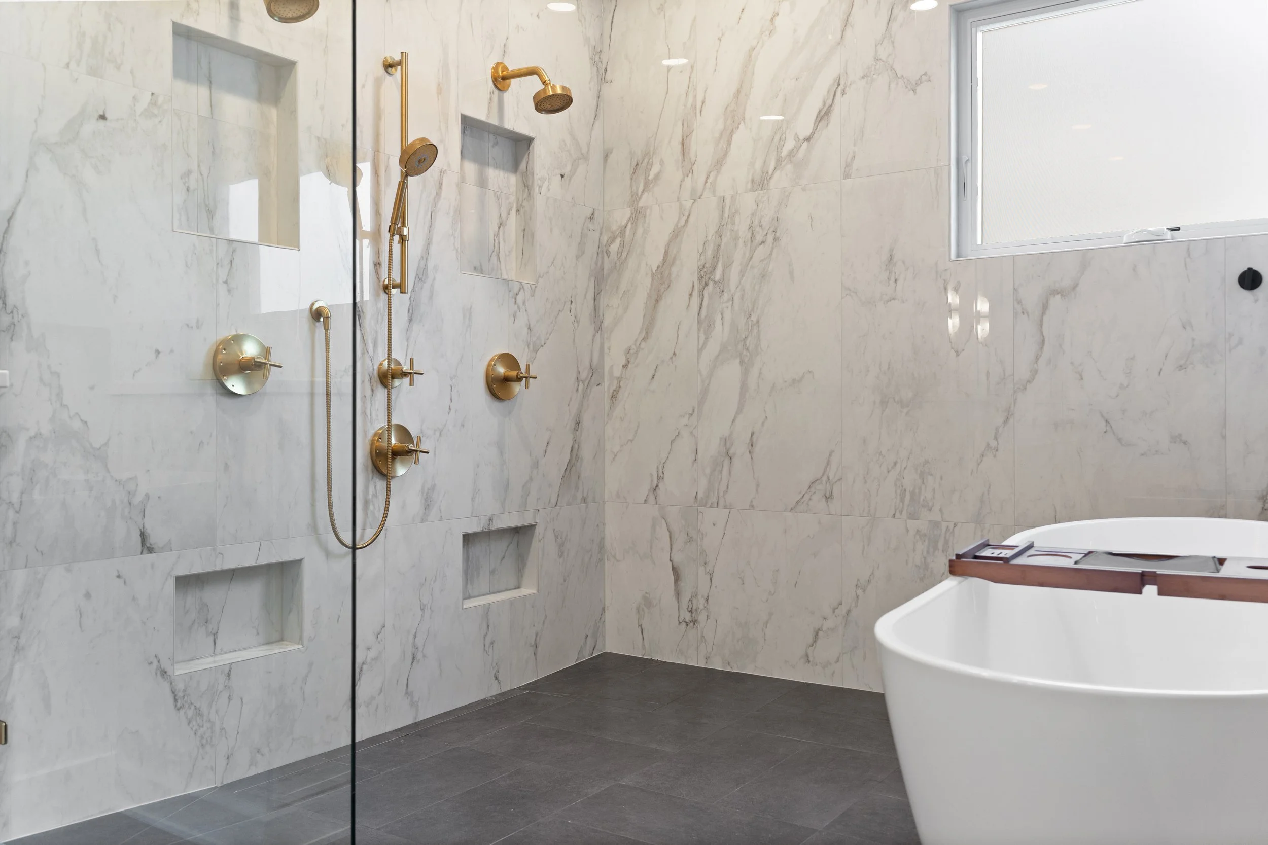 Custom double shower with floor to ceiling tile in Fort Thomas Kentucky master bath remodel by Shade Tree Homes