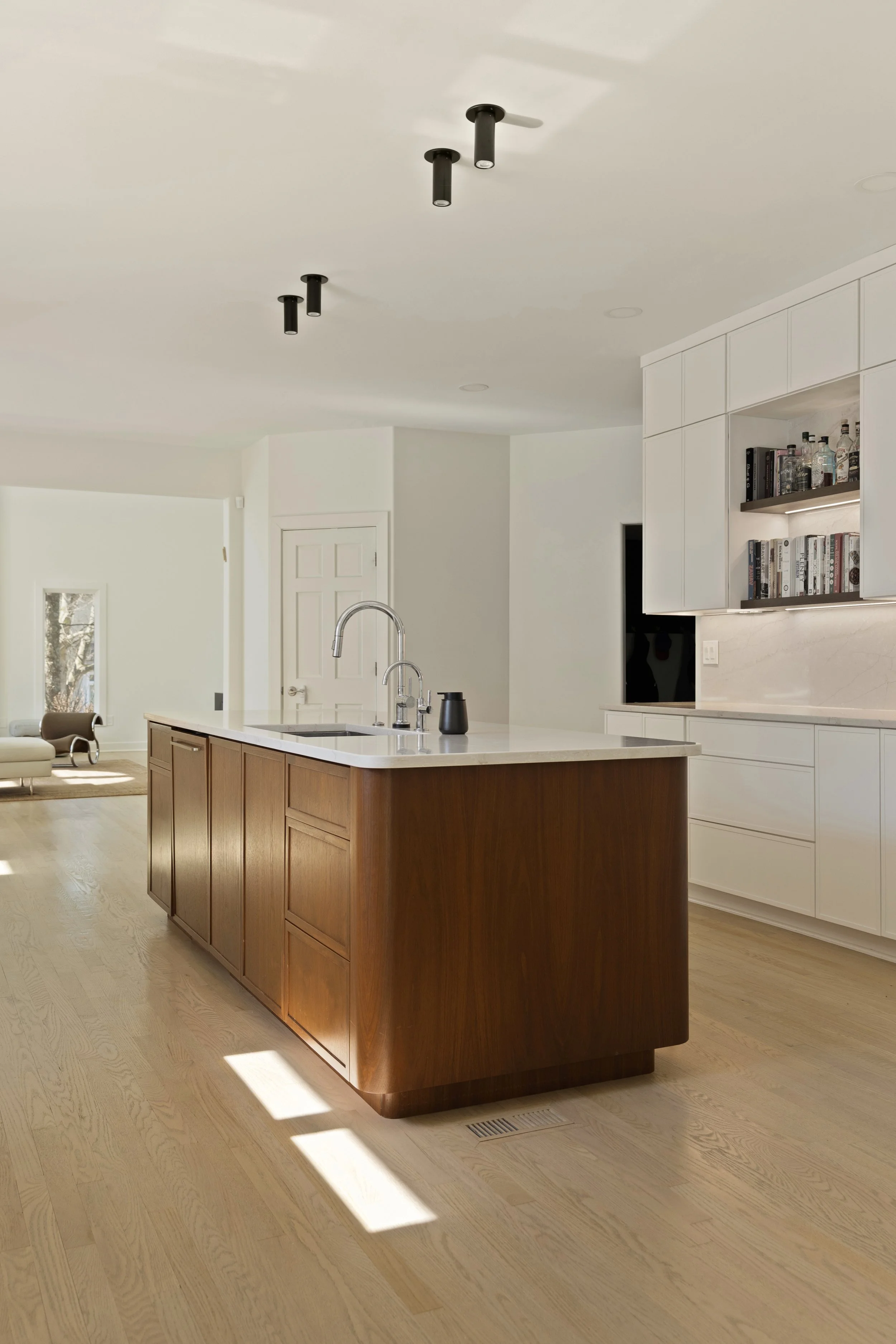 Custom kitchen overview showing layout and cabinetry in Amberley Village home by Shade Tree Homes