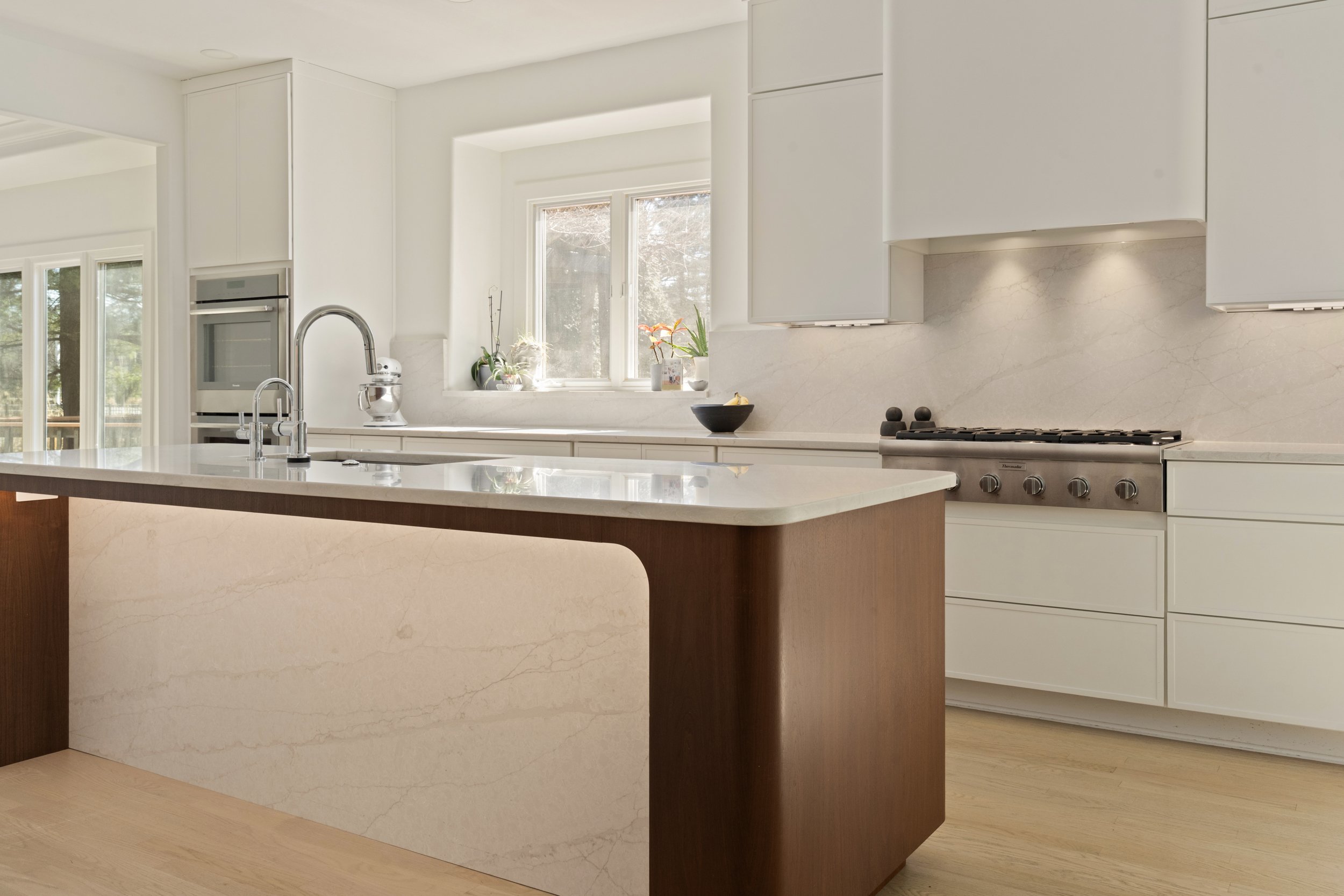 Wide view of custom kitchen with premium finishes in Amberley Village Ohio by Shade Tree Homes