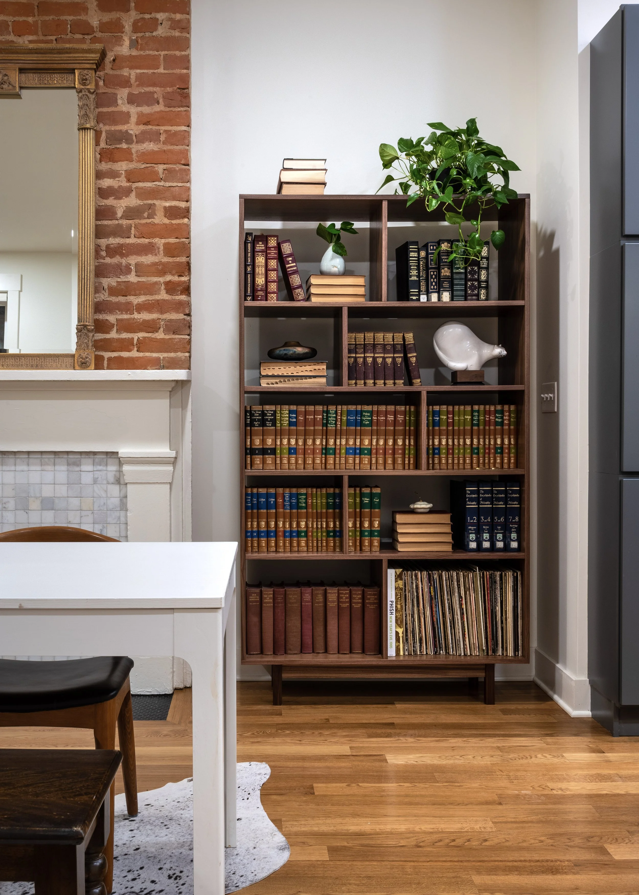 Built-in shelving with exposed brick detail in historic Covington Kentucky remodel by Shade Tree Homes