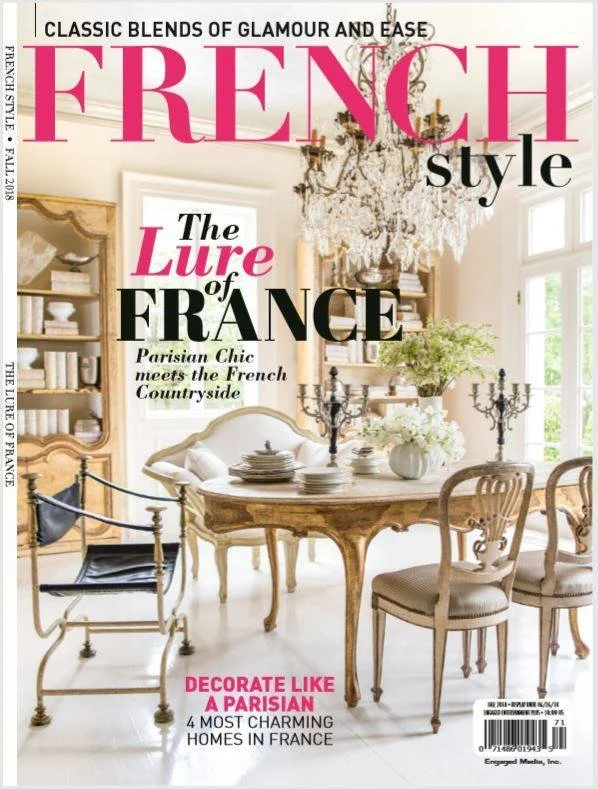 Cover of a magazine titled 'French Style' featuring a bright, elegant dining room with a chandelier, vintage chairs, a wooden table set with plates, a flower arrangement, and large windows allowing natural light.
