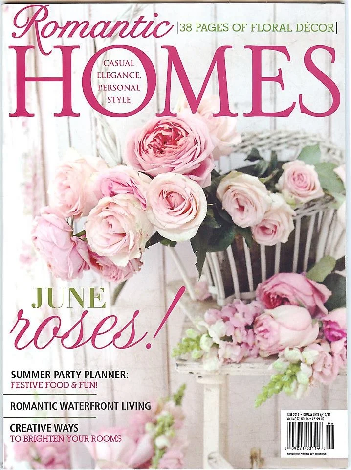 Cover of a magazine titled 'Romantic Homes' with a focus on pink roses and floral decor, for June issue.