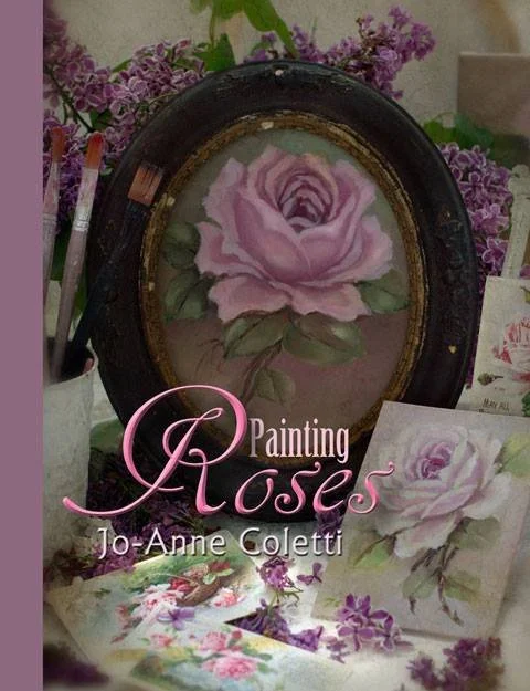 Book cover titled "Painting Roses" by Jo-Anne Coletti, featuring a pink rose painting in a black oval frame, surrounded by purple flowers and art supplies.