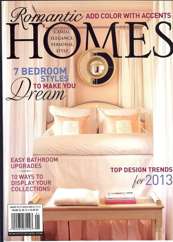 Artist, designer, Jo-Anne Coletti Cover of Romantic Homes magazine featuring a bedroom with a pink theme, a bed with white pillows, and a round decorative mirror above the headboard. 
