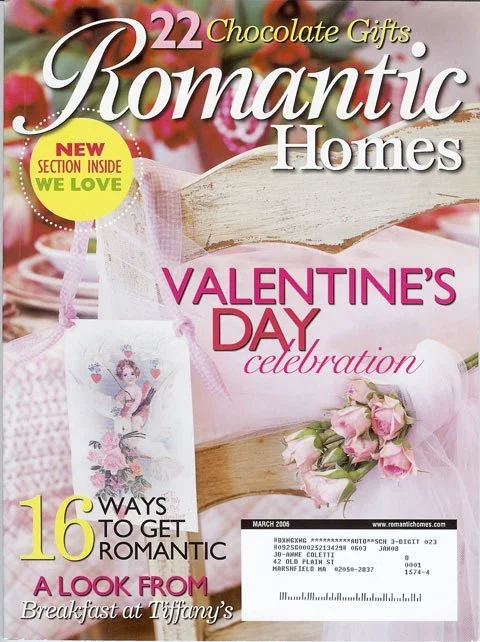 Artist, designer, Jo-Anne Coletti Cover of a magazine titled 'Romantic Homes,' featuring Valentine's Day celebration themes, pink and white colors, flowers, heart-shaped decorations, and a section on 16 romantic gift ideas.