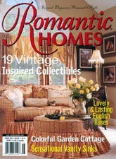 Artist, designer, Jo-Anne Coletti Cover of Romantic Homes magazine featuring a vintage garden cottage with a pink sofa, floral decor, and bright interior.
