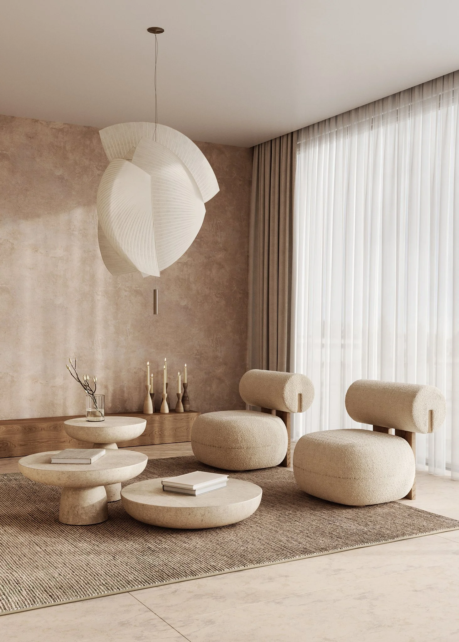 Modern living room with beige upholstered furniture, round stone coffee tables, a textured beige wall, a pendant light fixture, and sheer curtains covering a large window.