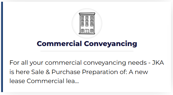 professional reviewing commercial property documents in an office setting, symbolizing commercial conveyancing services.