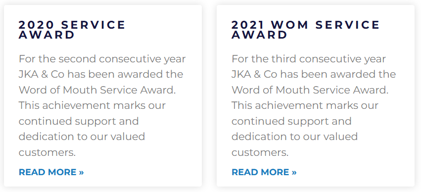 Two awards cards, one titled '2020 Service Award' and the other '2021 WOM Service Award,' each with a paragraph explaining the achievement and a 'Read More' link.
