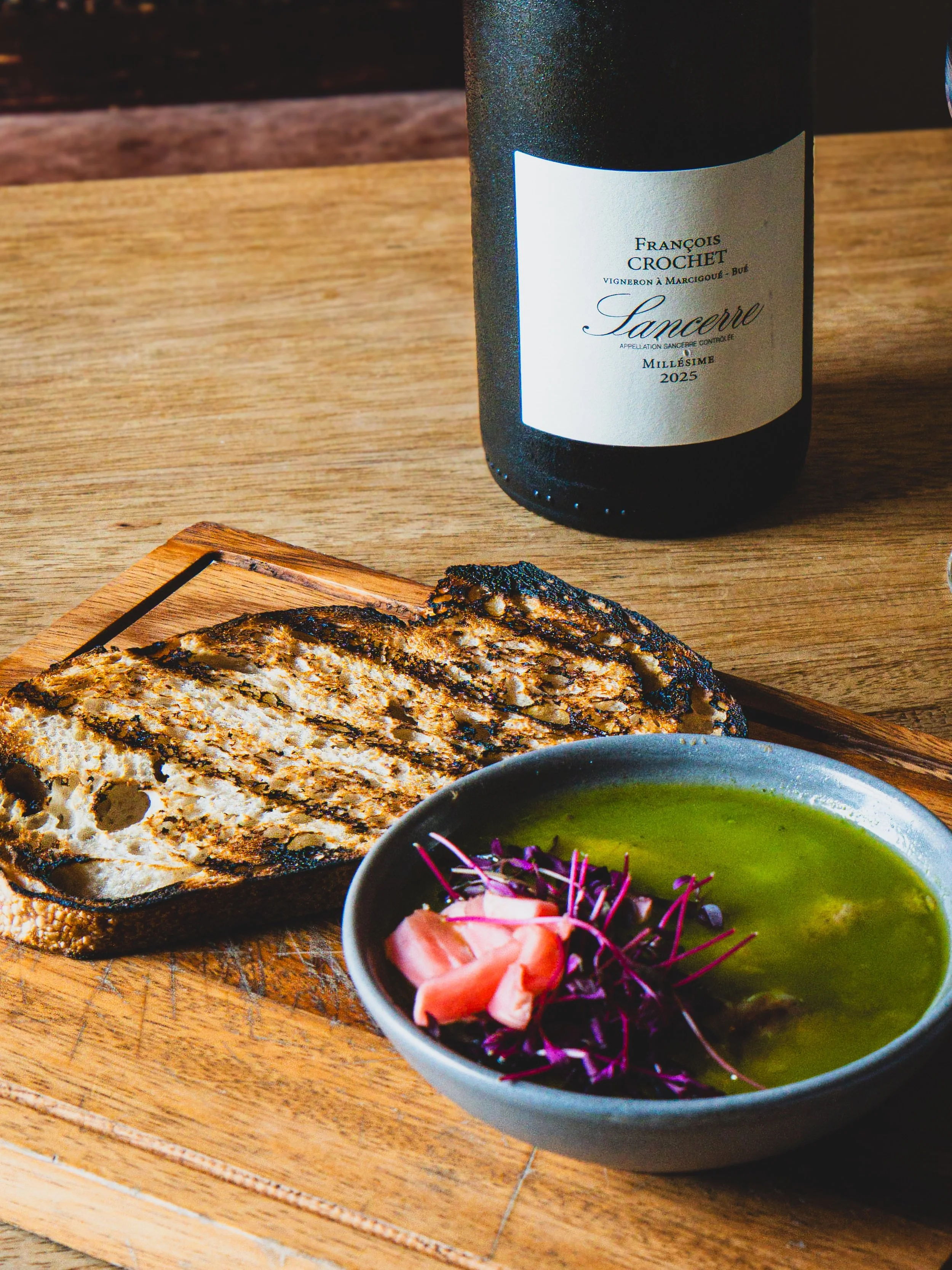 This is the one you&rsquo;ll be thinking about on the way home. Slow confit duck, potted under a layer of chervil butter, a bit of pickled radish for bite, and a big slice of charred sourdough to pile it all onto.
