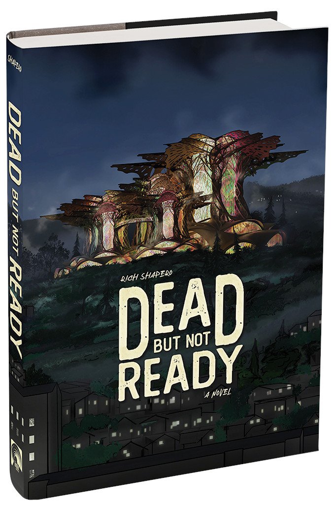 Book cover titled 'Dead but Not Ready' by Rich Shapero, depicting a dark, cityscape with large, fantasy-style trees illuminated at night.