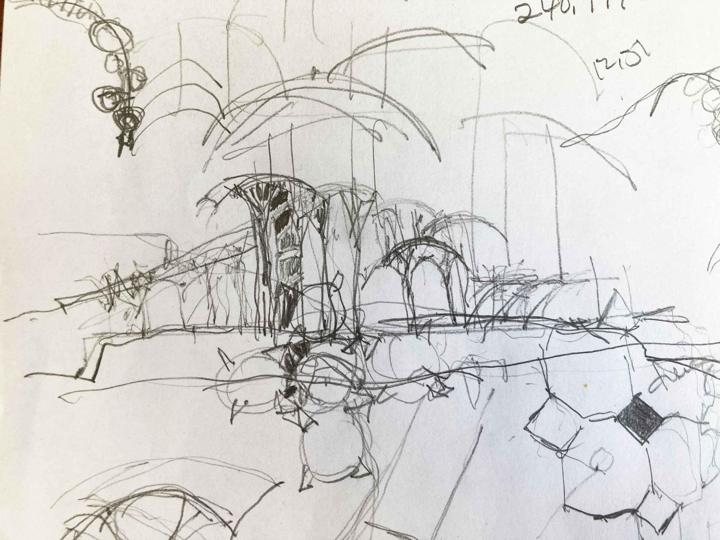 A rough sketch of a cityscape with multiple arched bridges, trees, and a building with a dome in the center.