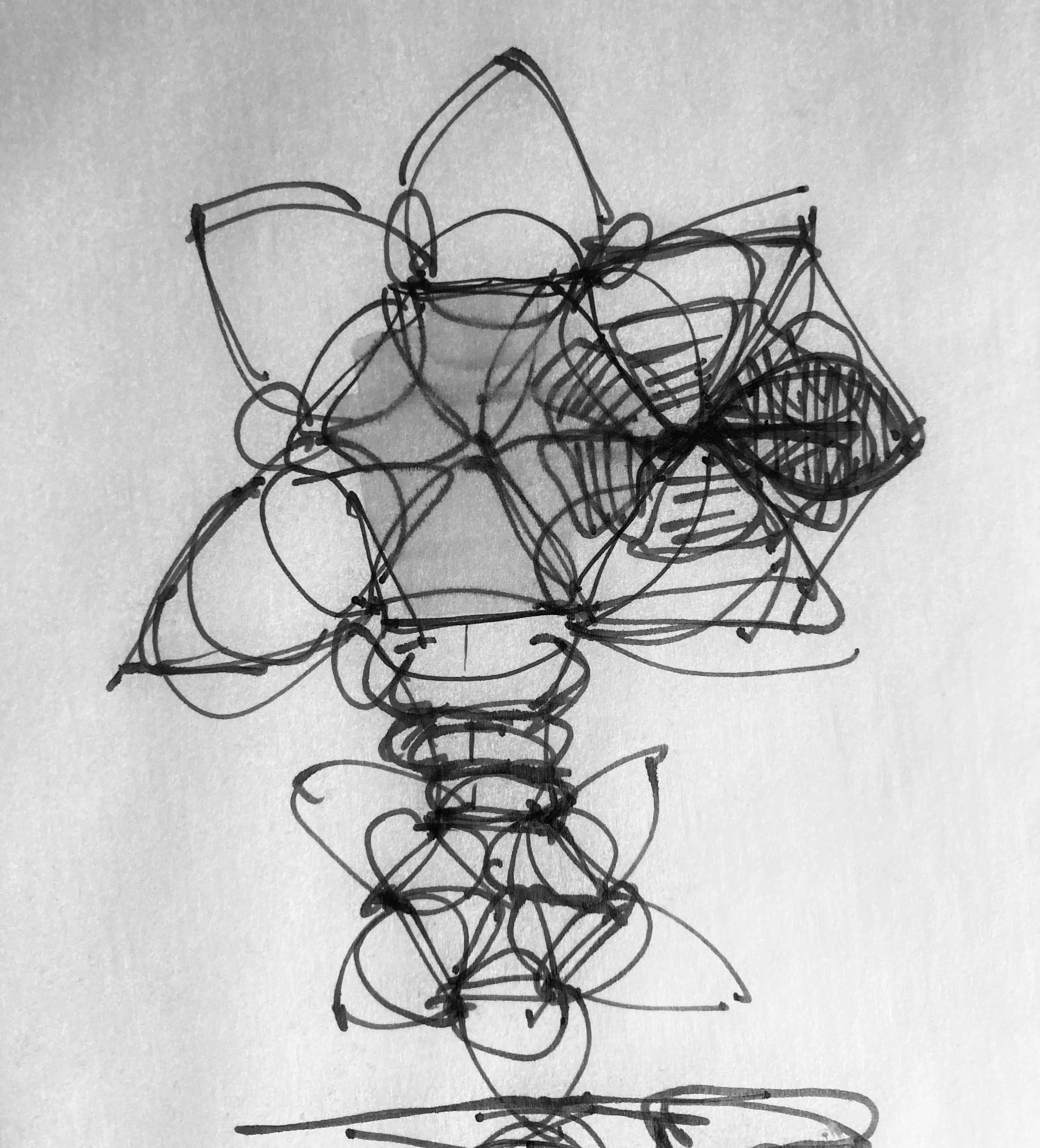 A black sketch on white paper consisting of overlapping, tangled lines forming abstract, unrecognizable shapes.