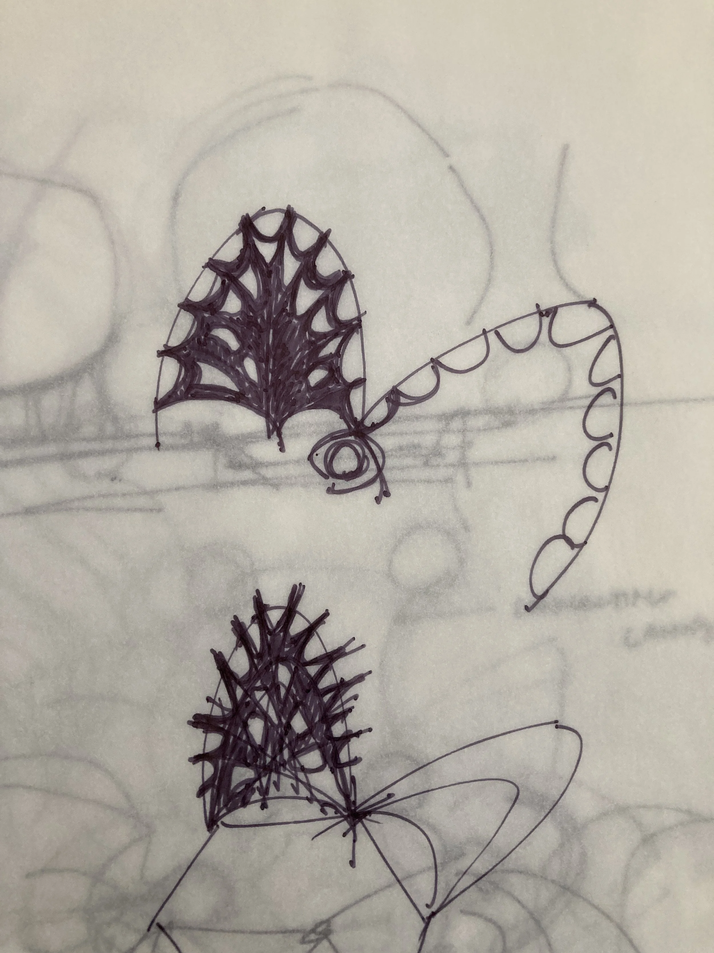 Hand-drawn sketches of various shapes and objects, including abstract patterns.