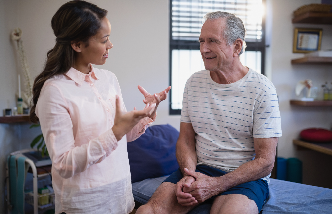 physical therapist providing education to a patient