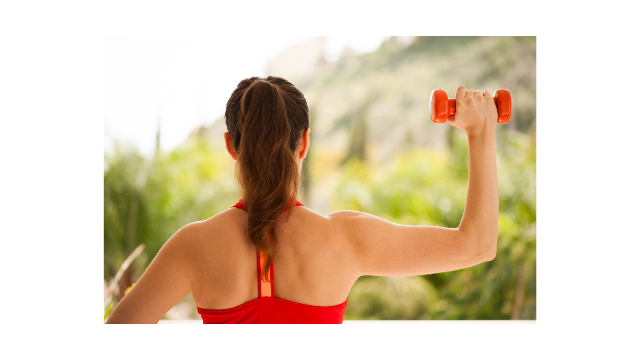 woman performing military press shoulder exercise