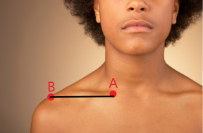 close up of man showing the distance and angle of his clavicle