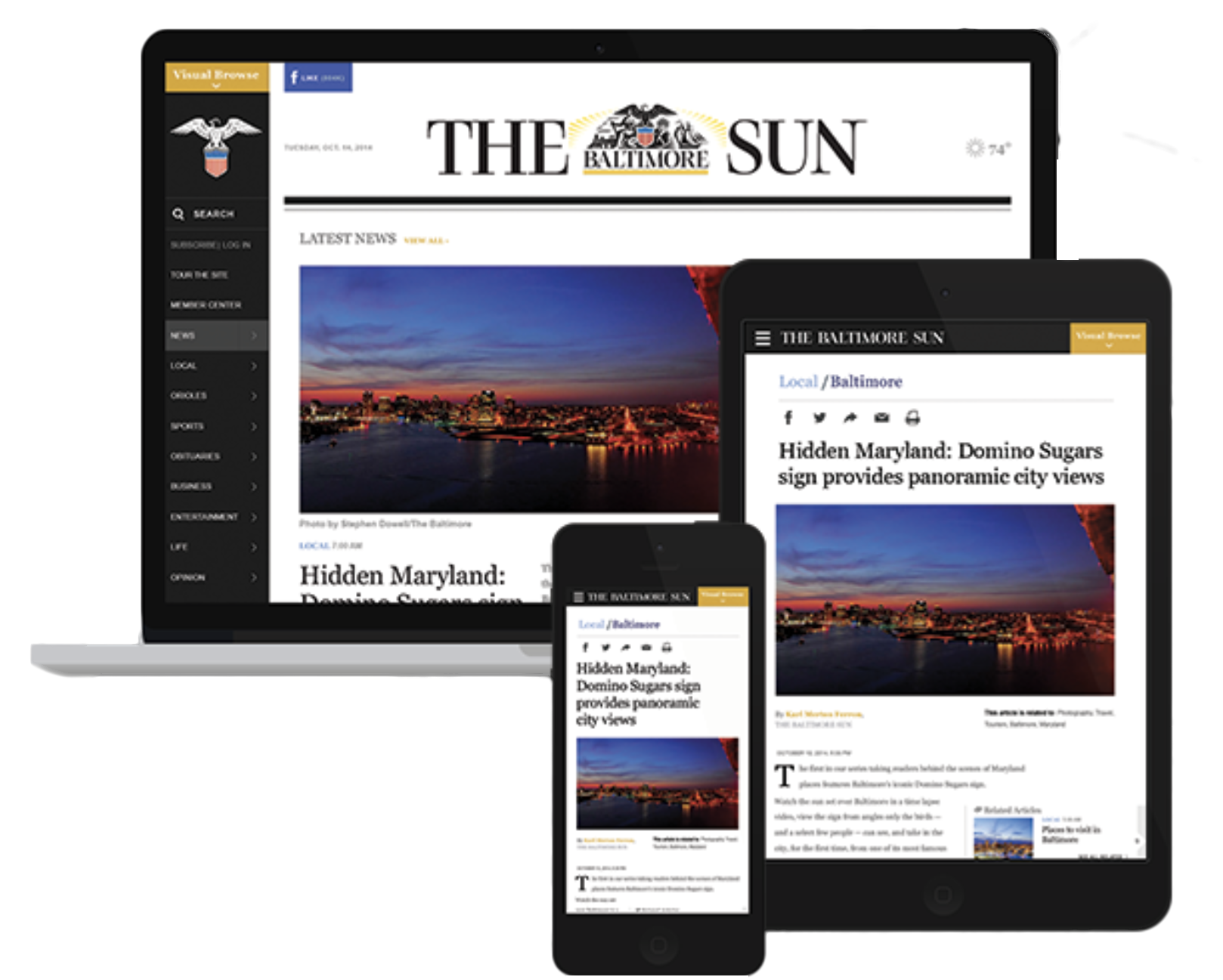 Multiple electronic devices displaying the front page of The Baltimore Sun newspaper, including a laptop, tablet, and smartphone, with a feature article about a panoramic city view from a Domino Sugas sign in Baltimore.