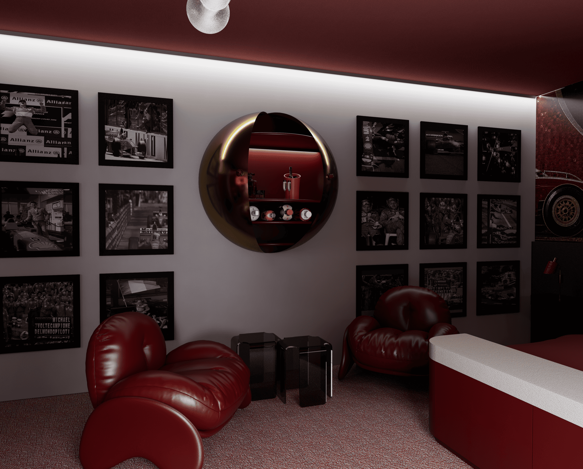 Suite Ferrari avec un mur orné de photos de courses de formule 1 en noir et blanc, un miroir rond encadré de lumière, plusieurs fauteuils en cuir rouge et un comptoir en marbre blanc avec un fond rouge. 