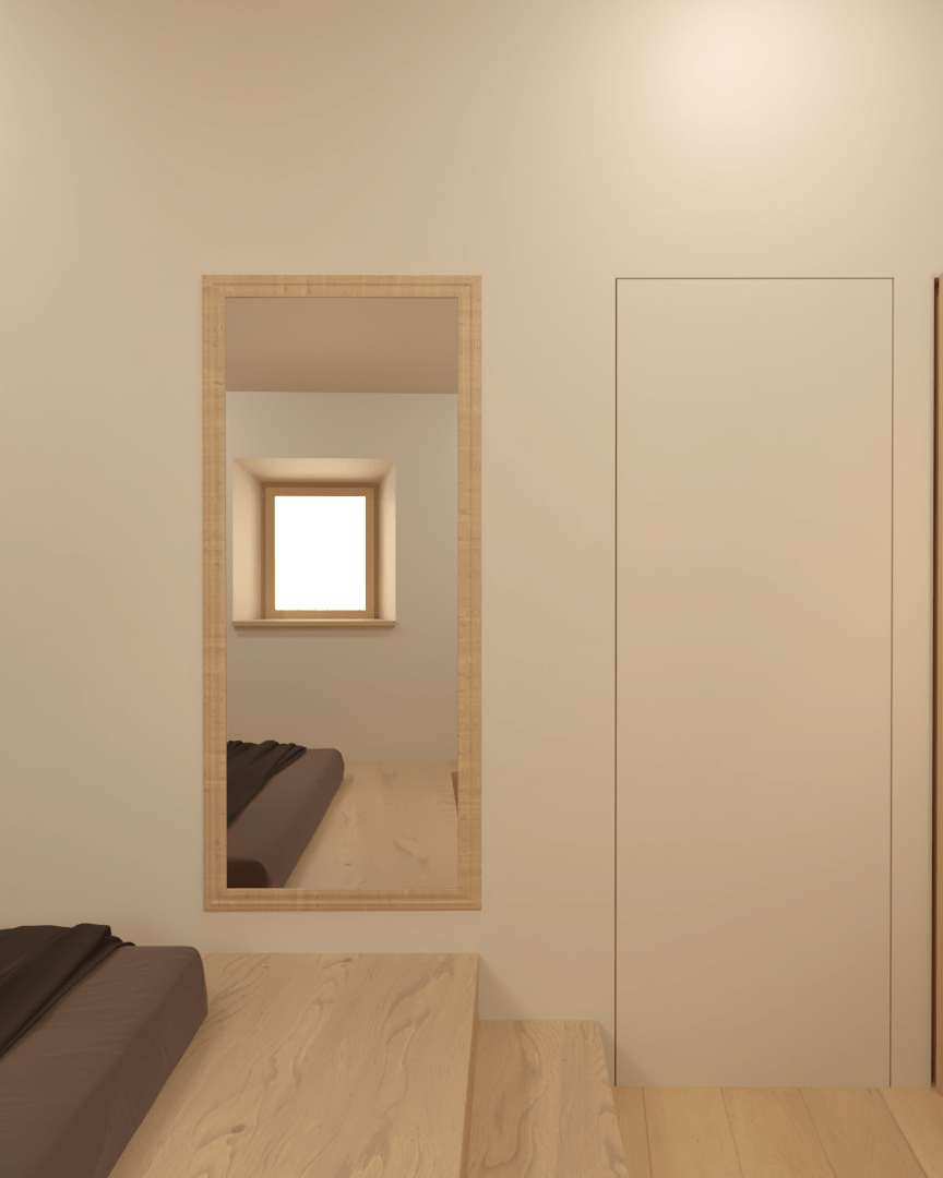 Rénovation haut de gamme d'une maison dans l'Aveyron, à Cantobre avec chambre minimaliste avec un lit en bois près d'une fenêtre, un miroir encadré en bois sur le mur, et une porte blanche. Agencement sur mesures.